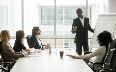 African businessman presenting new project to partners, black coach giving presentation to clients at conference meeting room, dark skinned team leader reporting about work result with whiteboard