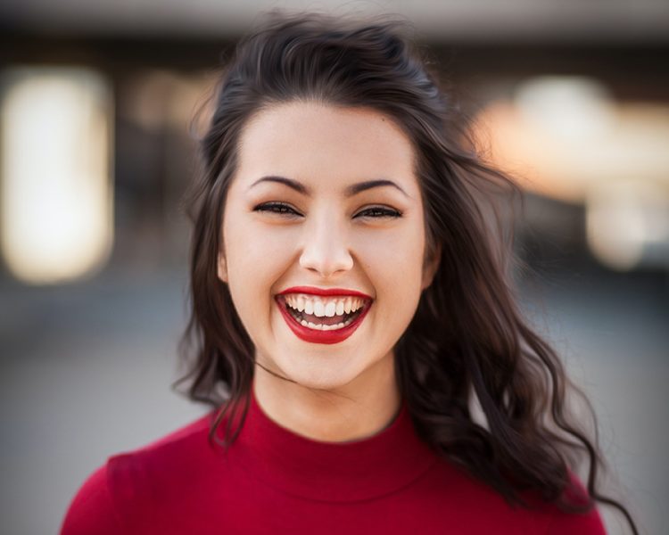 young-woman-smiling-happily-at-the-camera